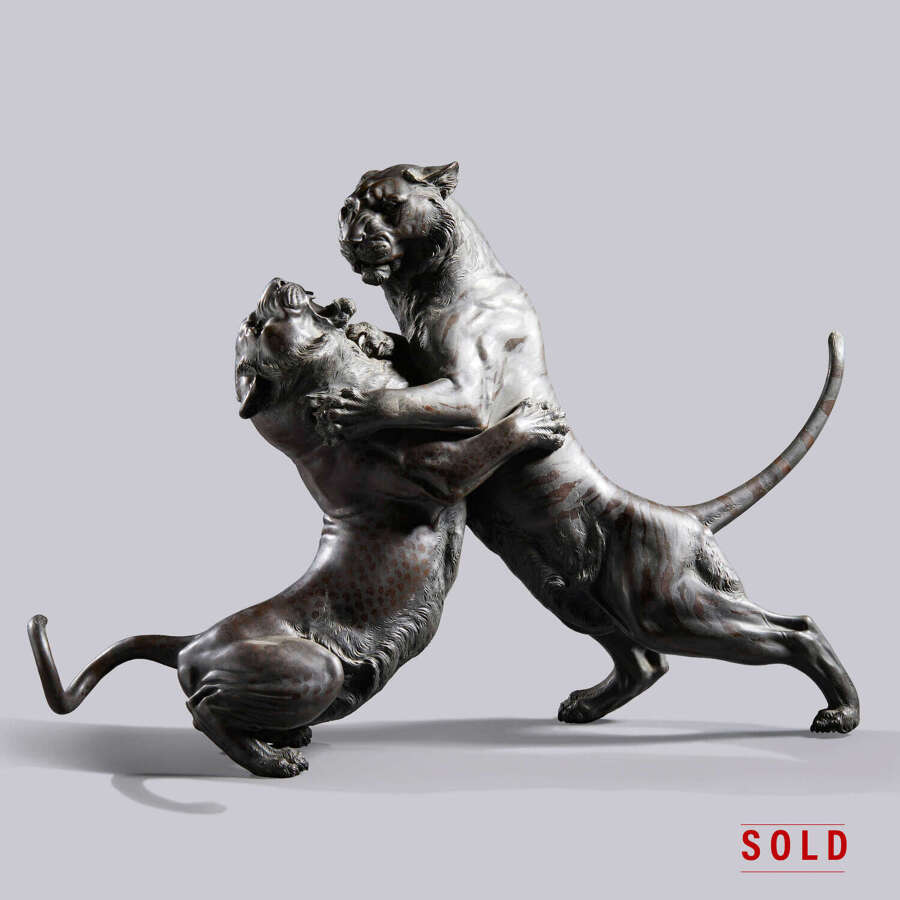 Japanese bronze group of a tiger and a leopard in combat signed Hanehiroya Meiji period