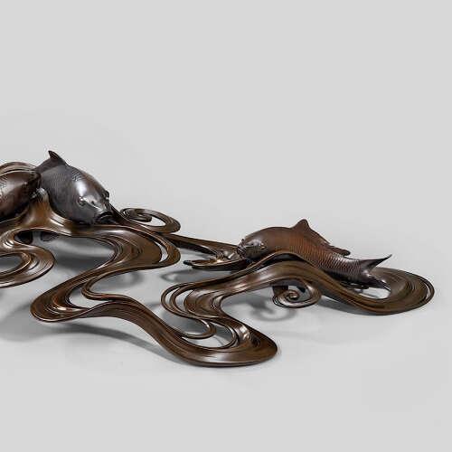 Japanese bronze of koi carps swimming through waves signed Ōshima Joun Meiji period