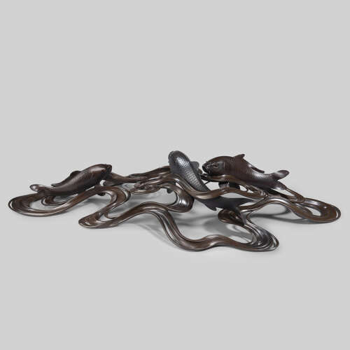 Japanese bronze of koi carps swimming through waves signed Ōshima Joun Meiji period